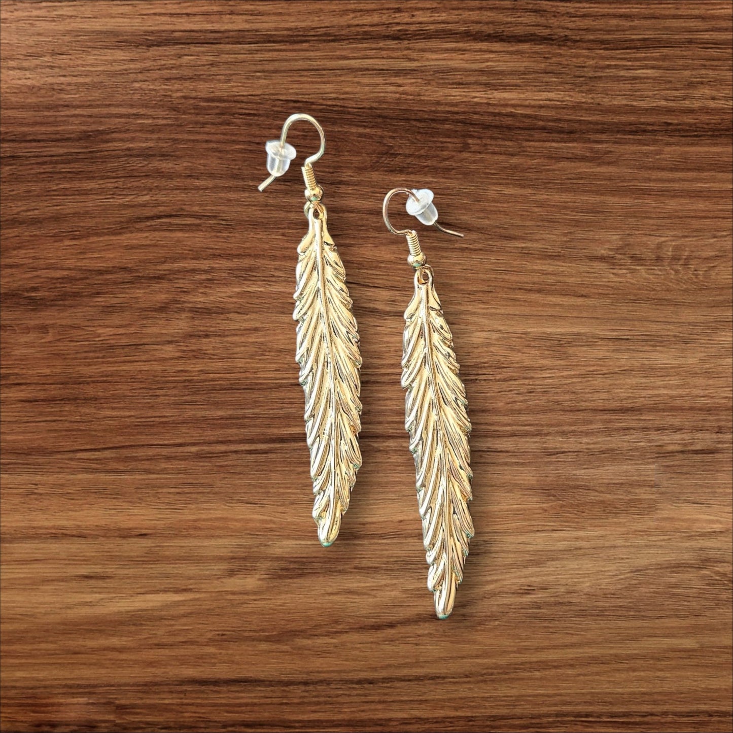 57 Gold Feather Earrings